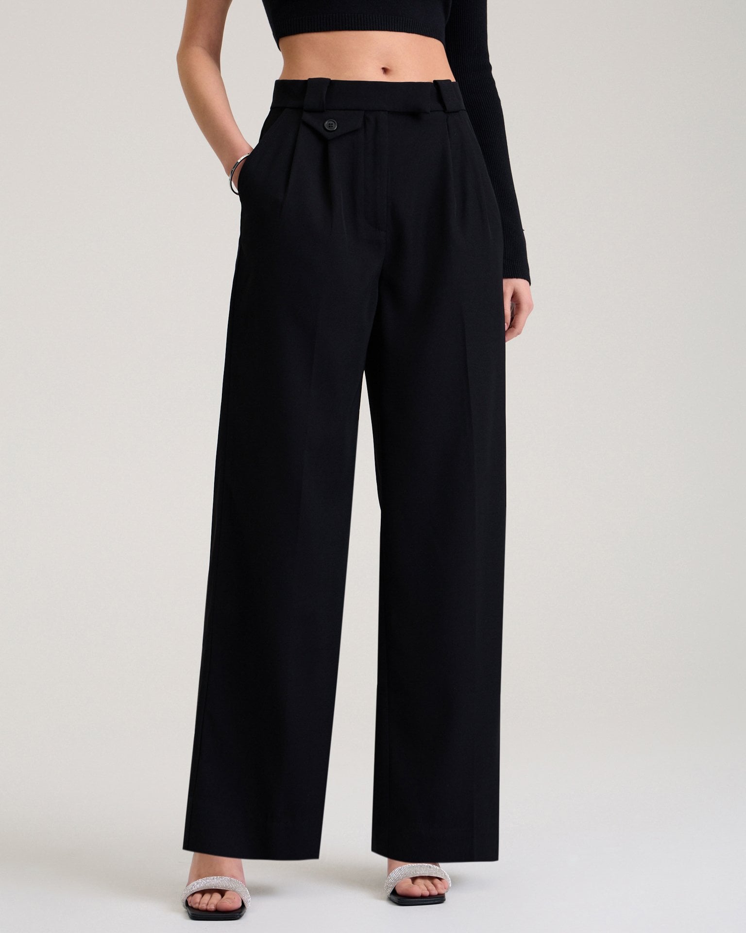 Trousers with decorative pocket in black