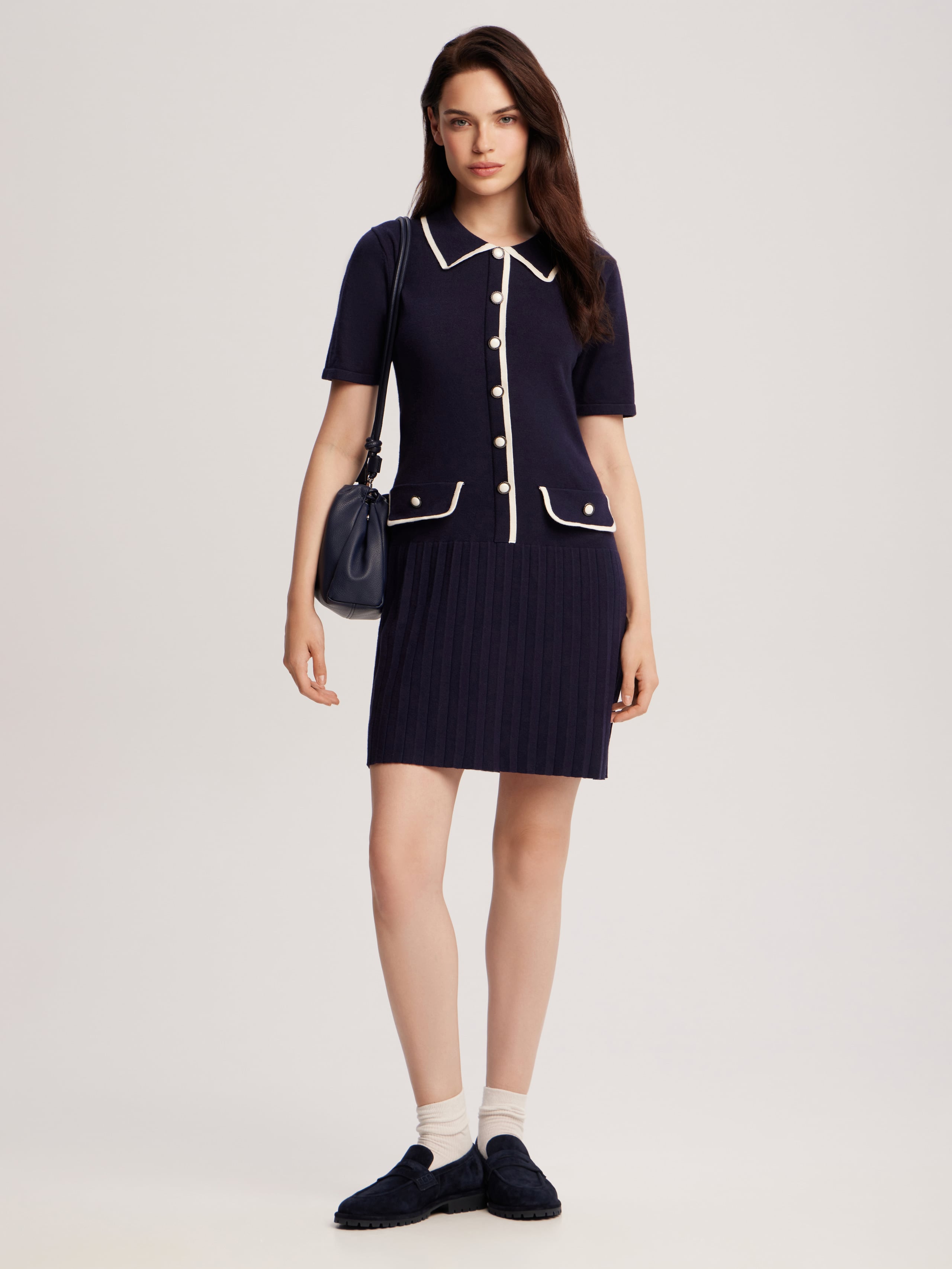 Dress with pleated hem