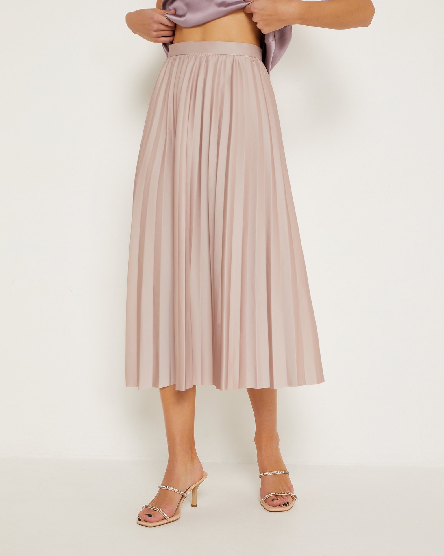 A long pleated skirt in beige, Beige
