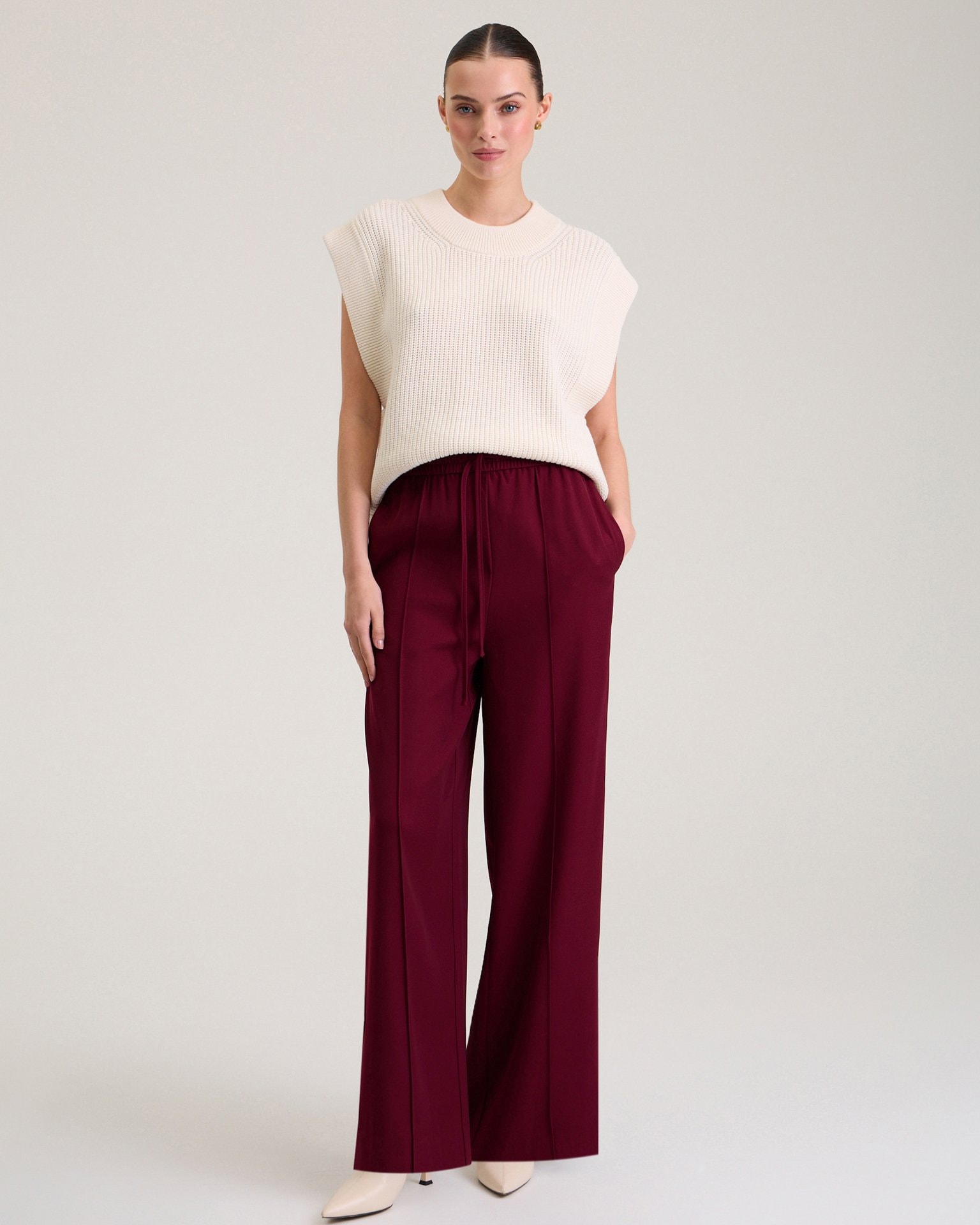 Trousers with textured creases, Red