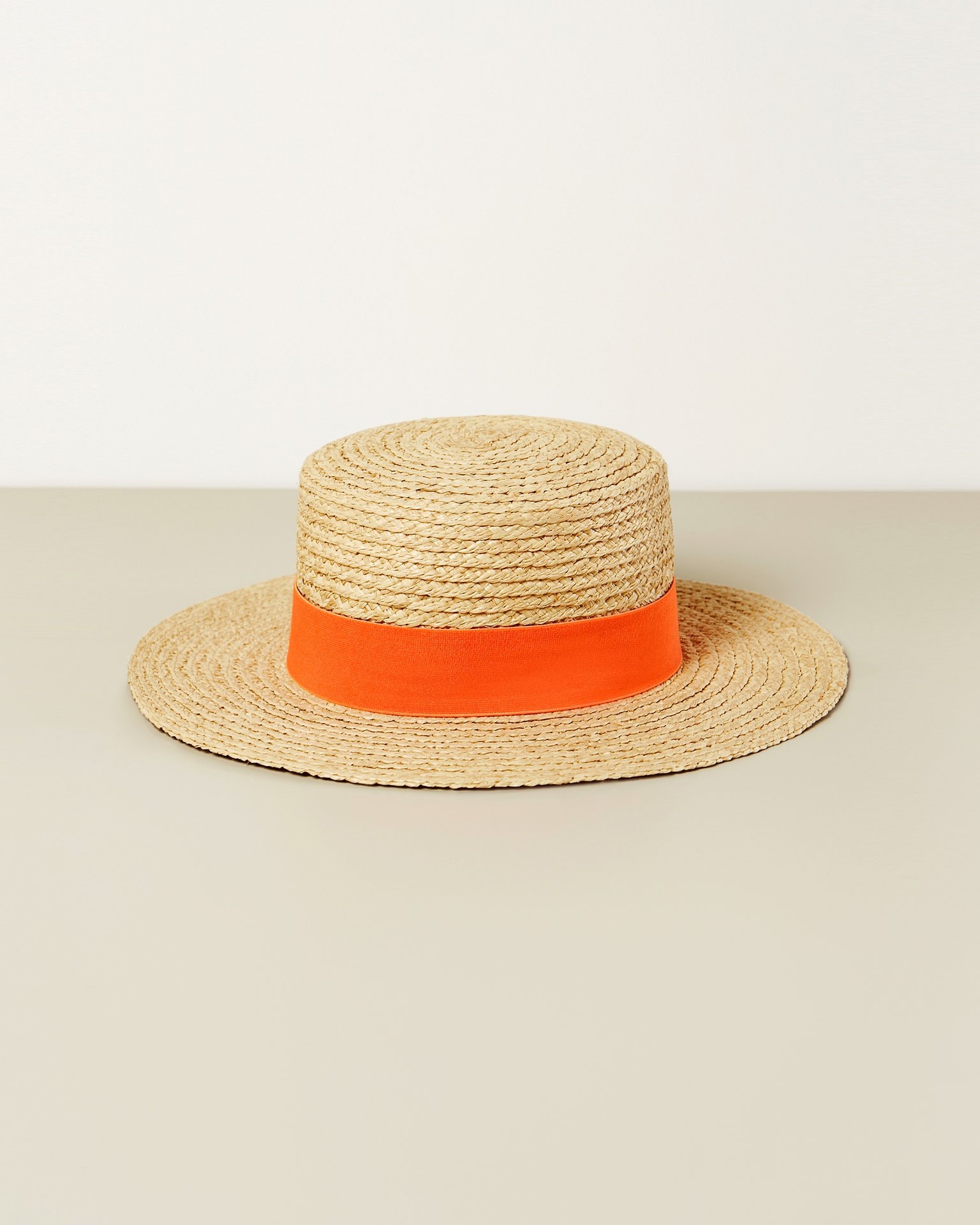 A hat with a contrasting ribbon, Orange