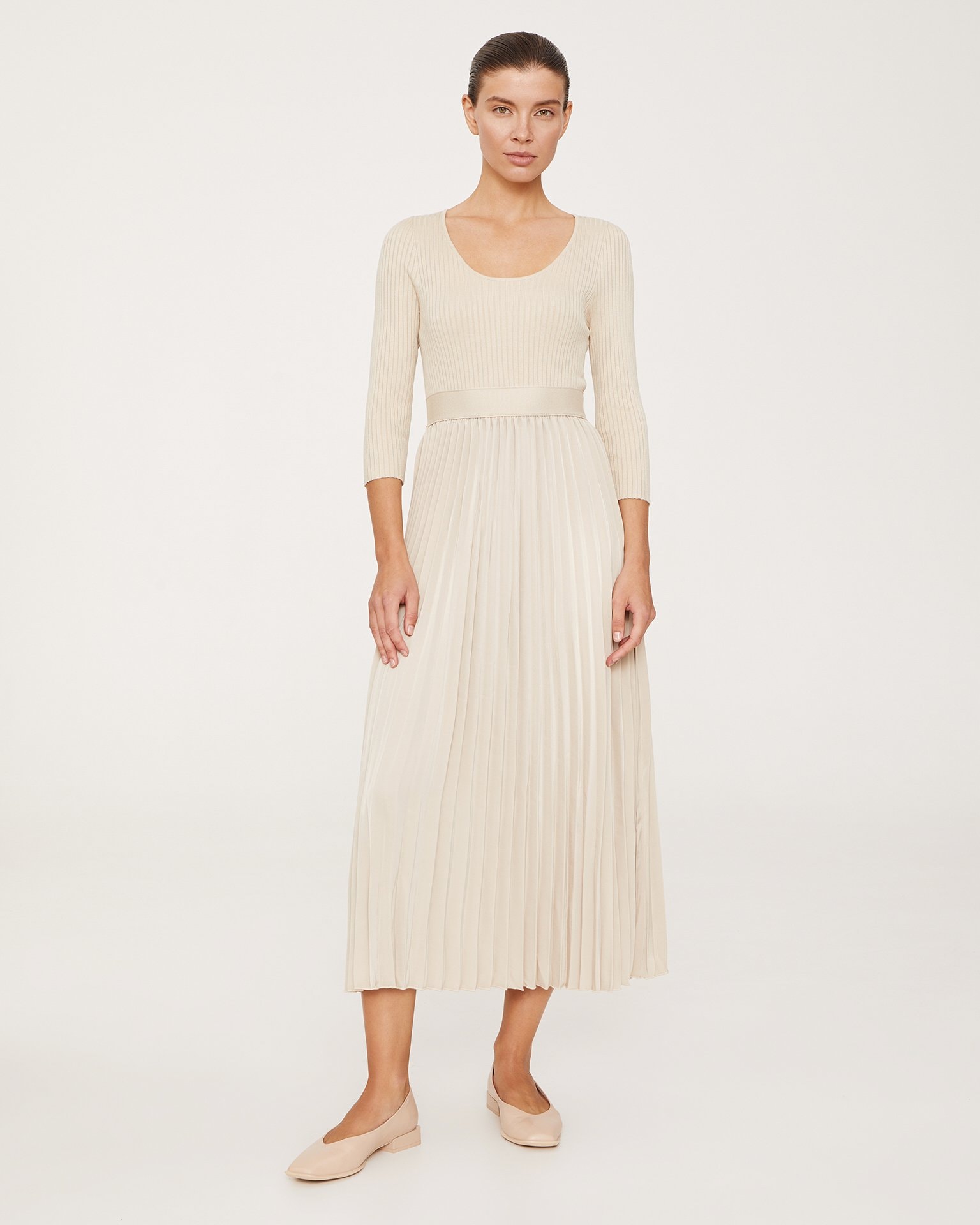 A dress with a pleated skirt, Beige