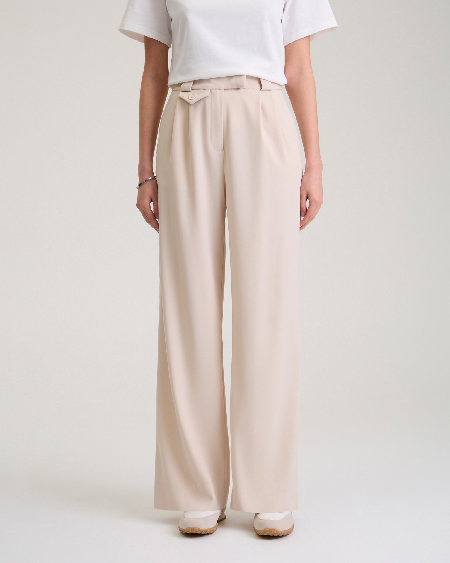 Trousers with a decorative pocket in beige, Beige