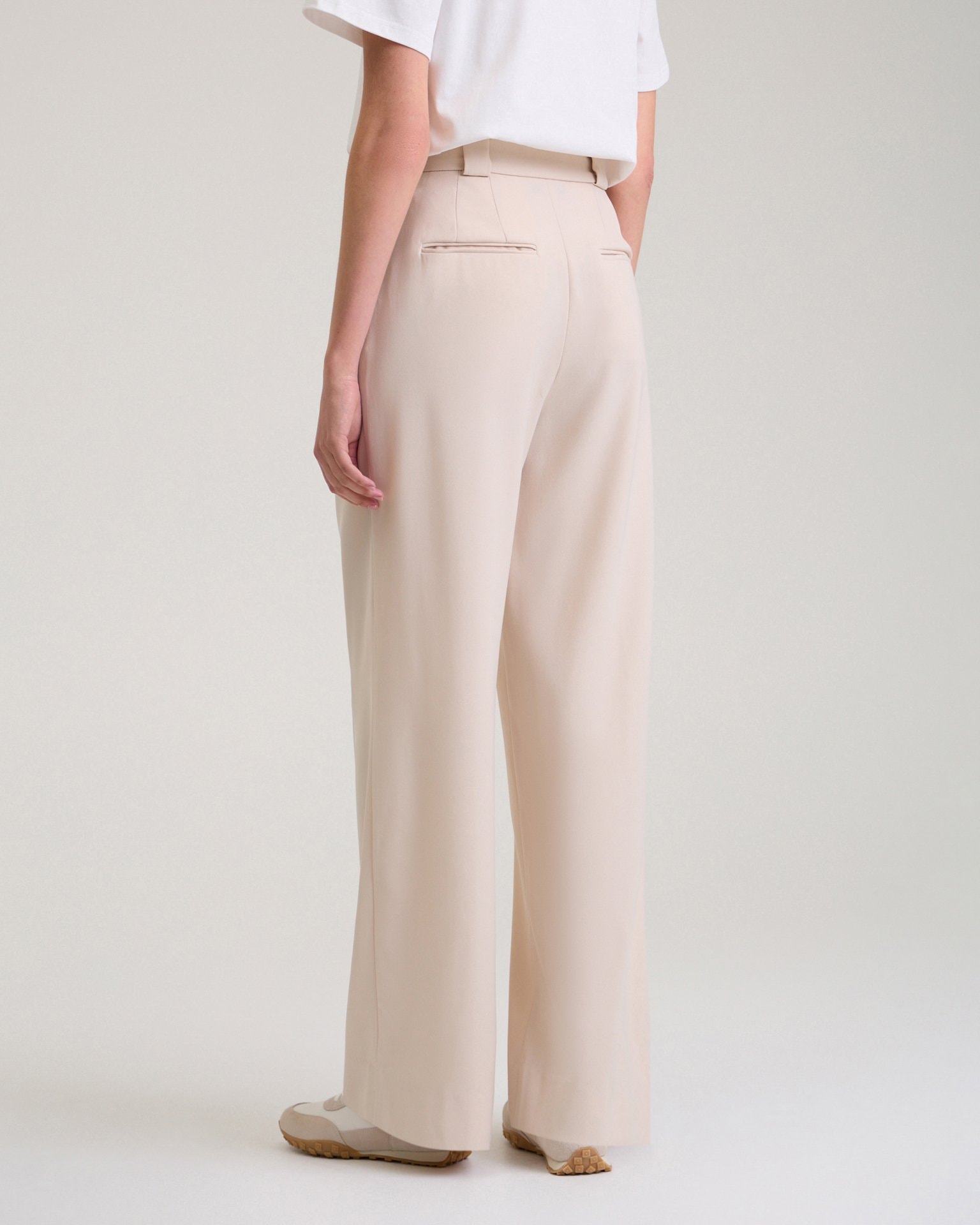 Trousers with a decorative pocket in beige, Beige — photo 2