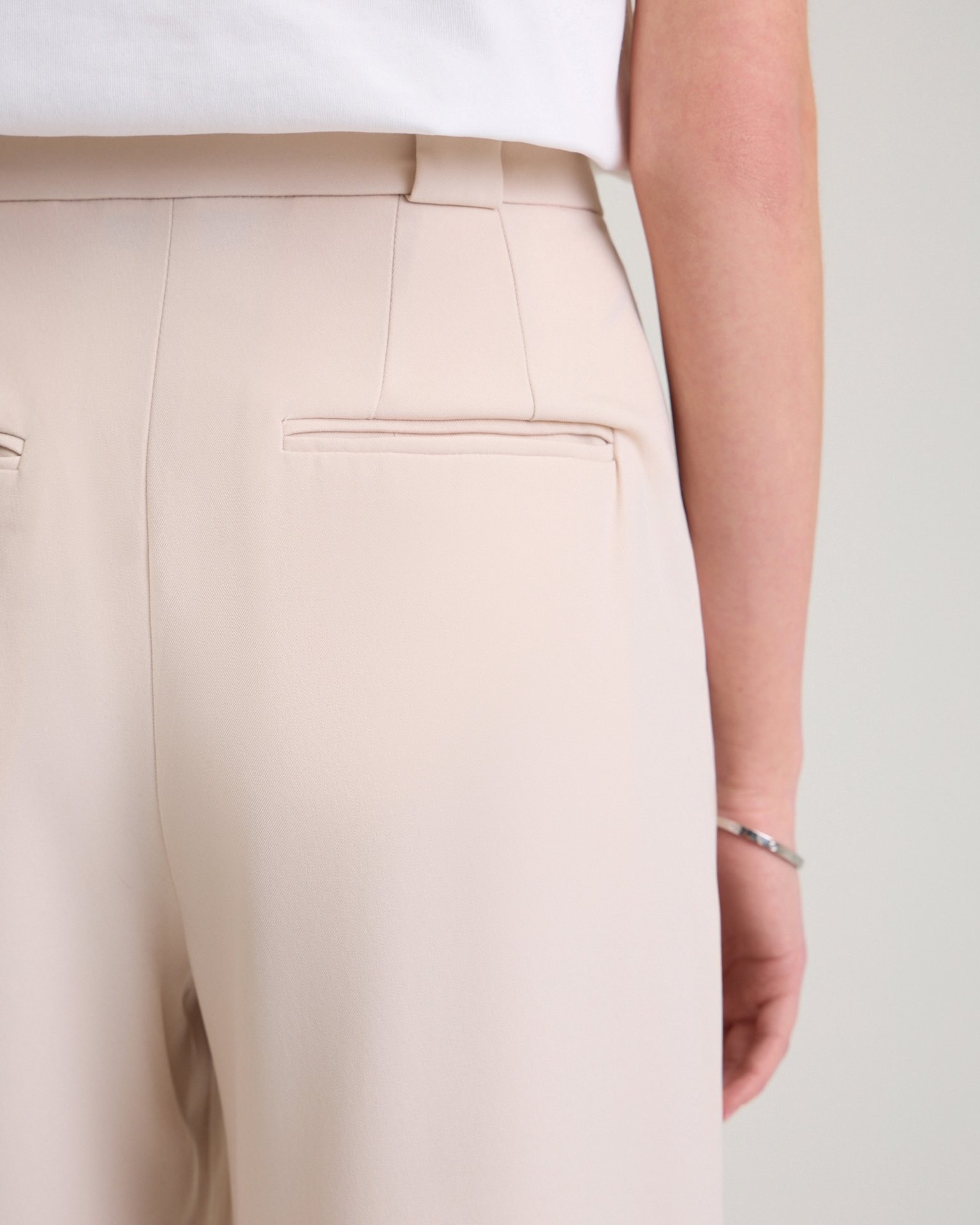 Trousers with a decorative pocket in beige, Beige — photo 9