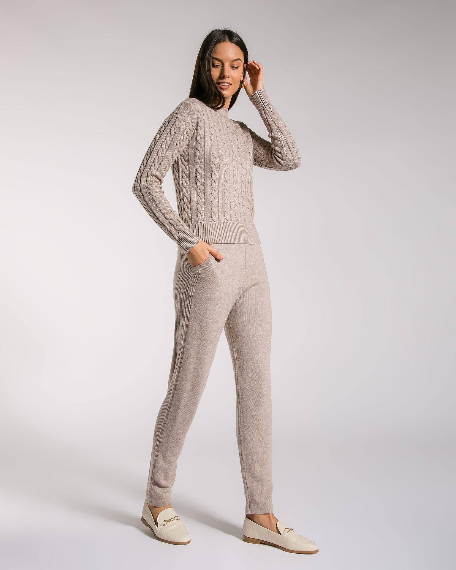 A two-piece trouser suit, adorned with a knitted cable pattern, Brown