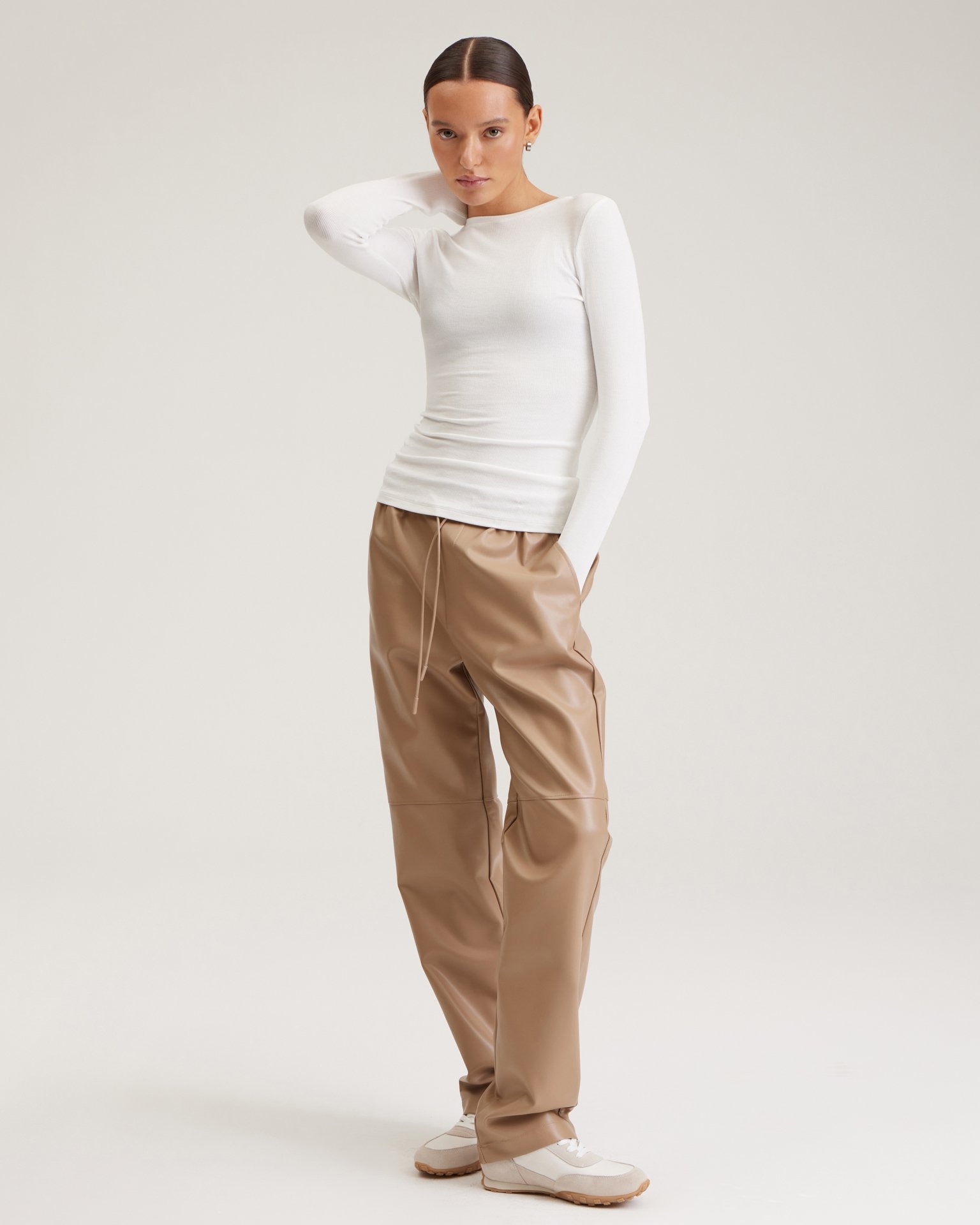 Coffee-coloured faux leather trousers