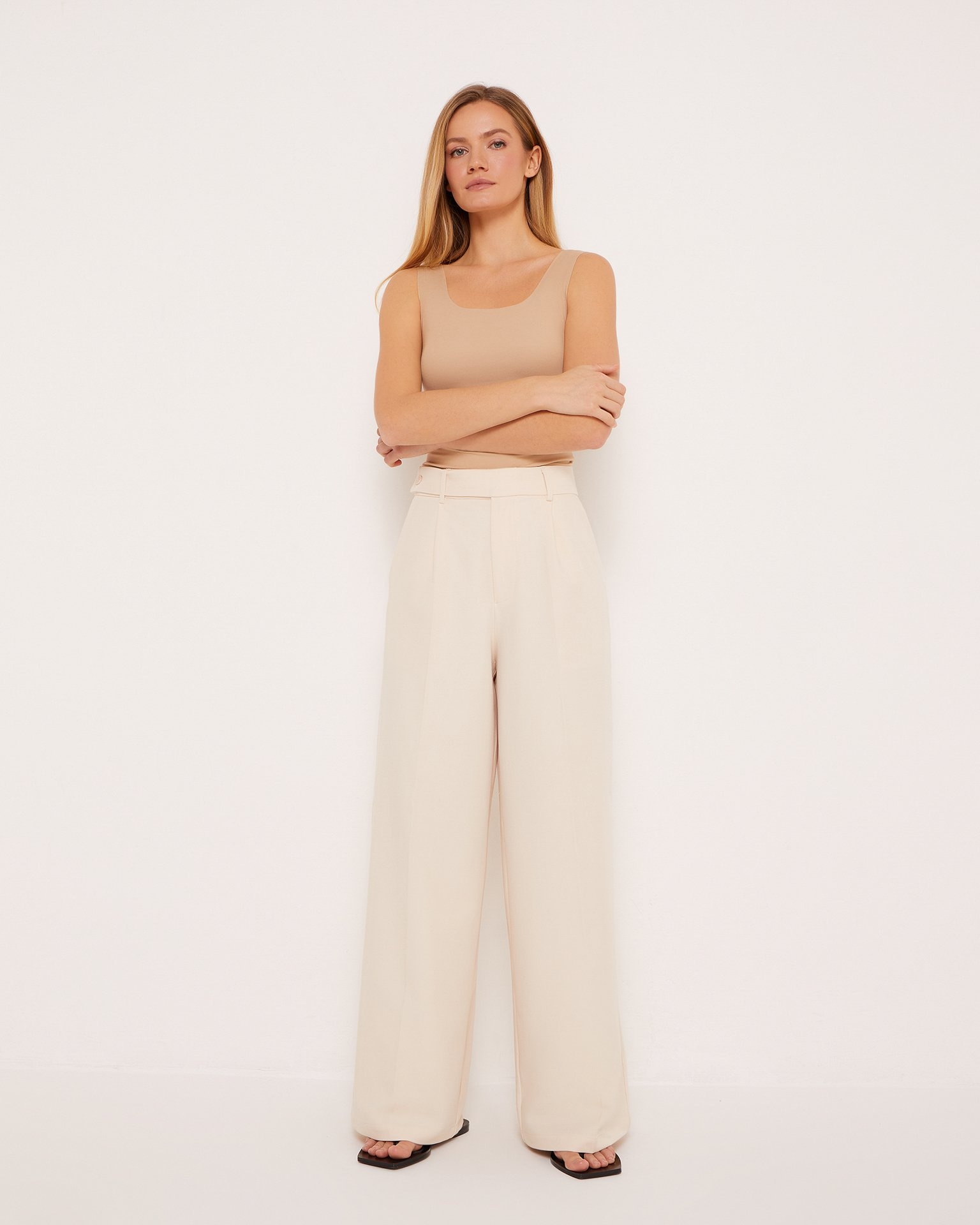 Loose-fit beige trousers