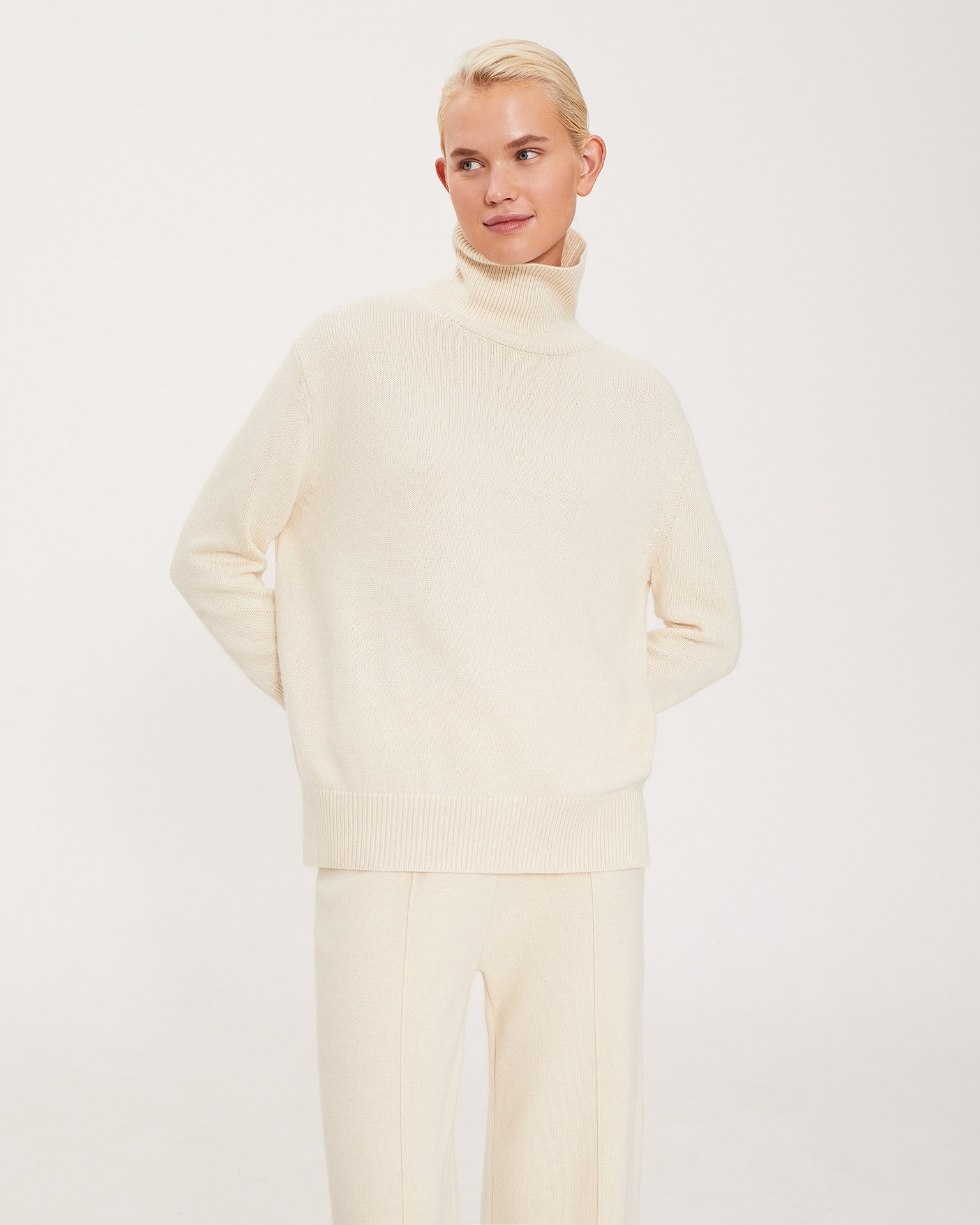 A knitwear suit in a milky colour