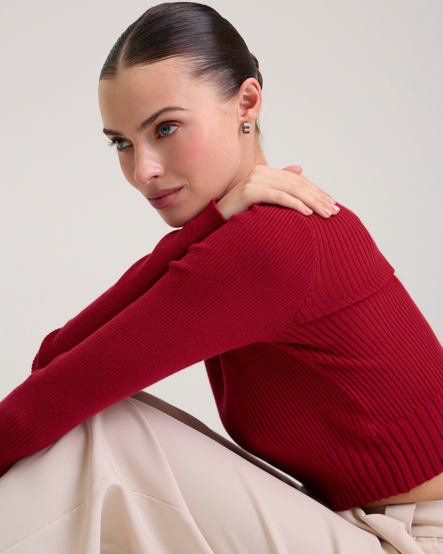 A cropped red jumper