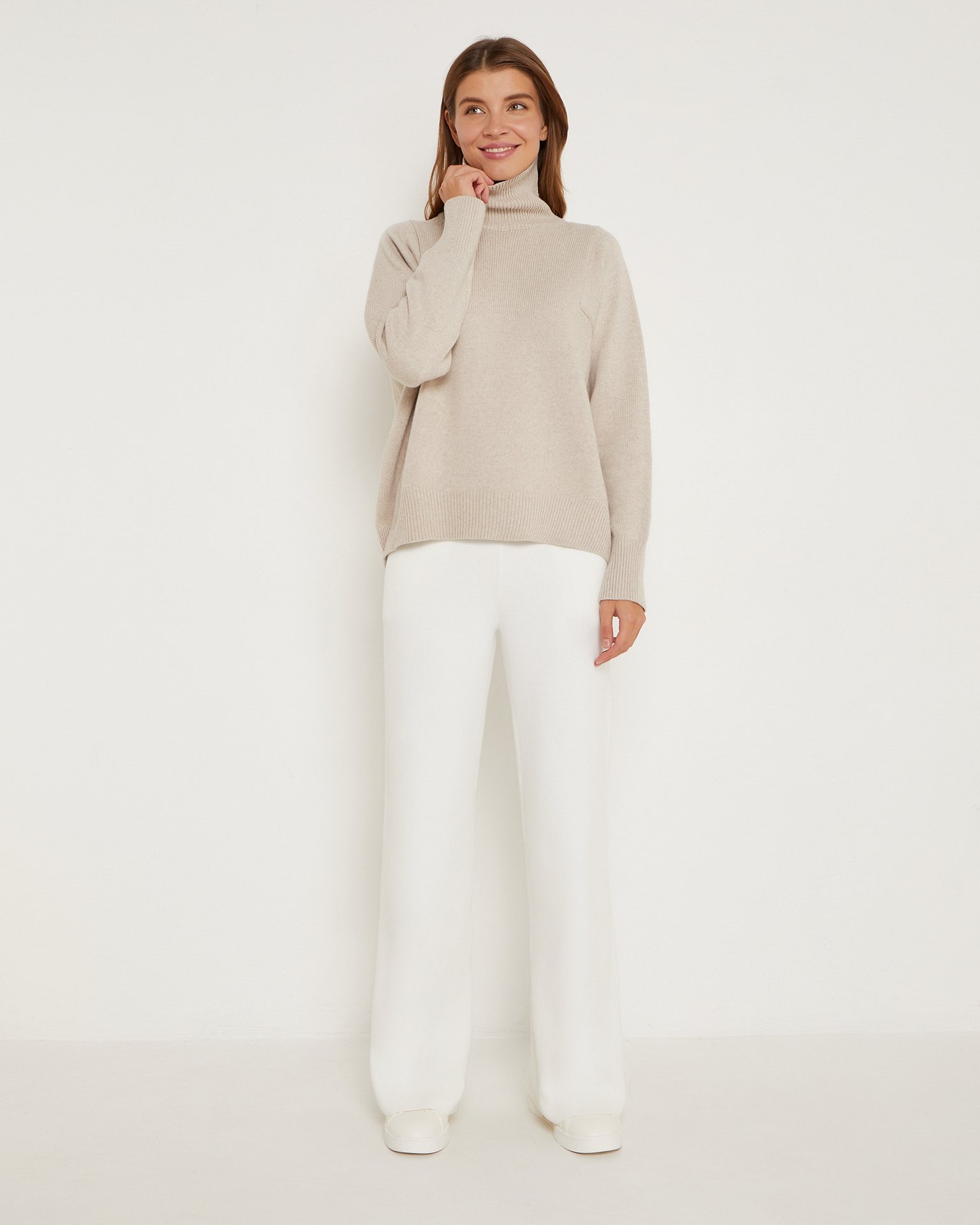 A basic turtleneck jumper in beige