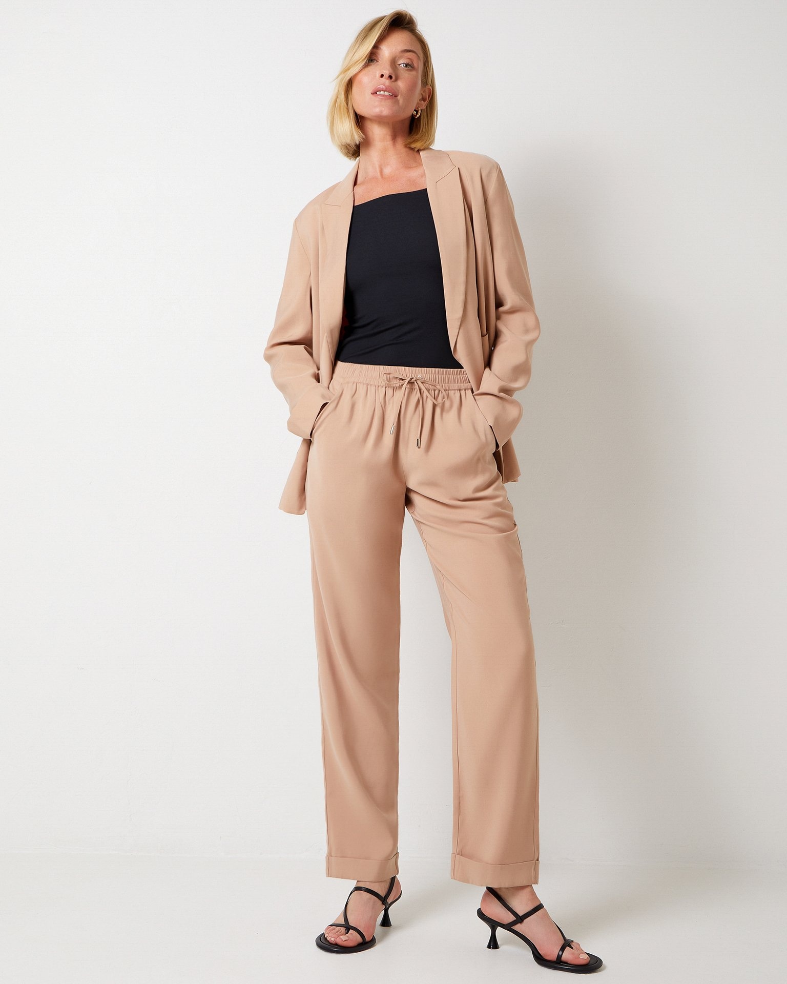 Beige elasticated trousers
