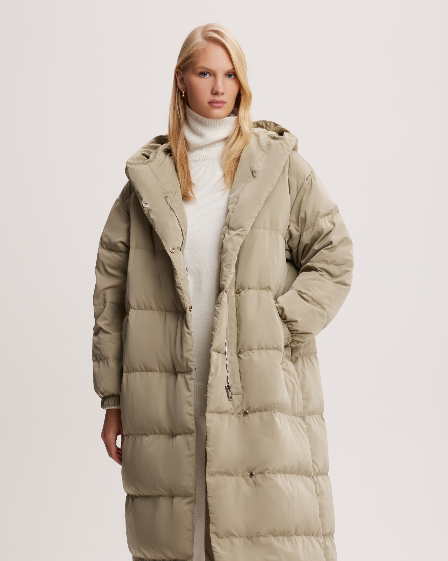 Khaki puffer jacket with snap fasteners