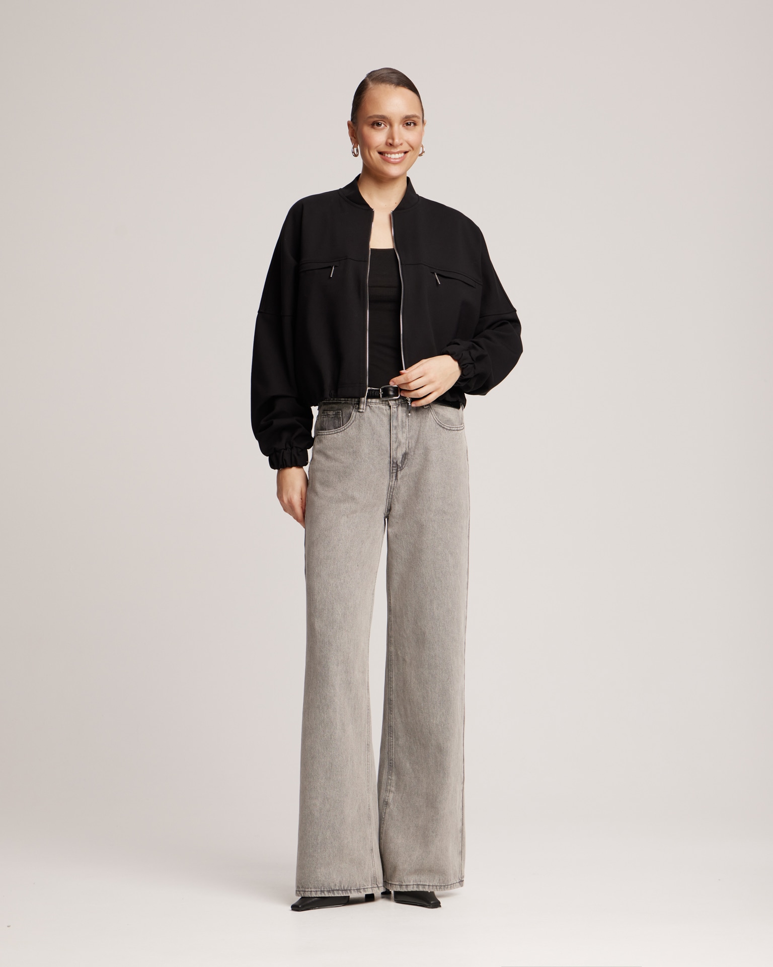 Black bomber jacket with adjustable ribbed hem