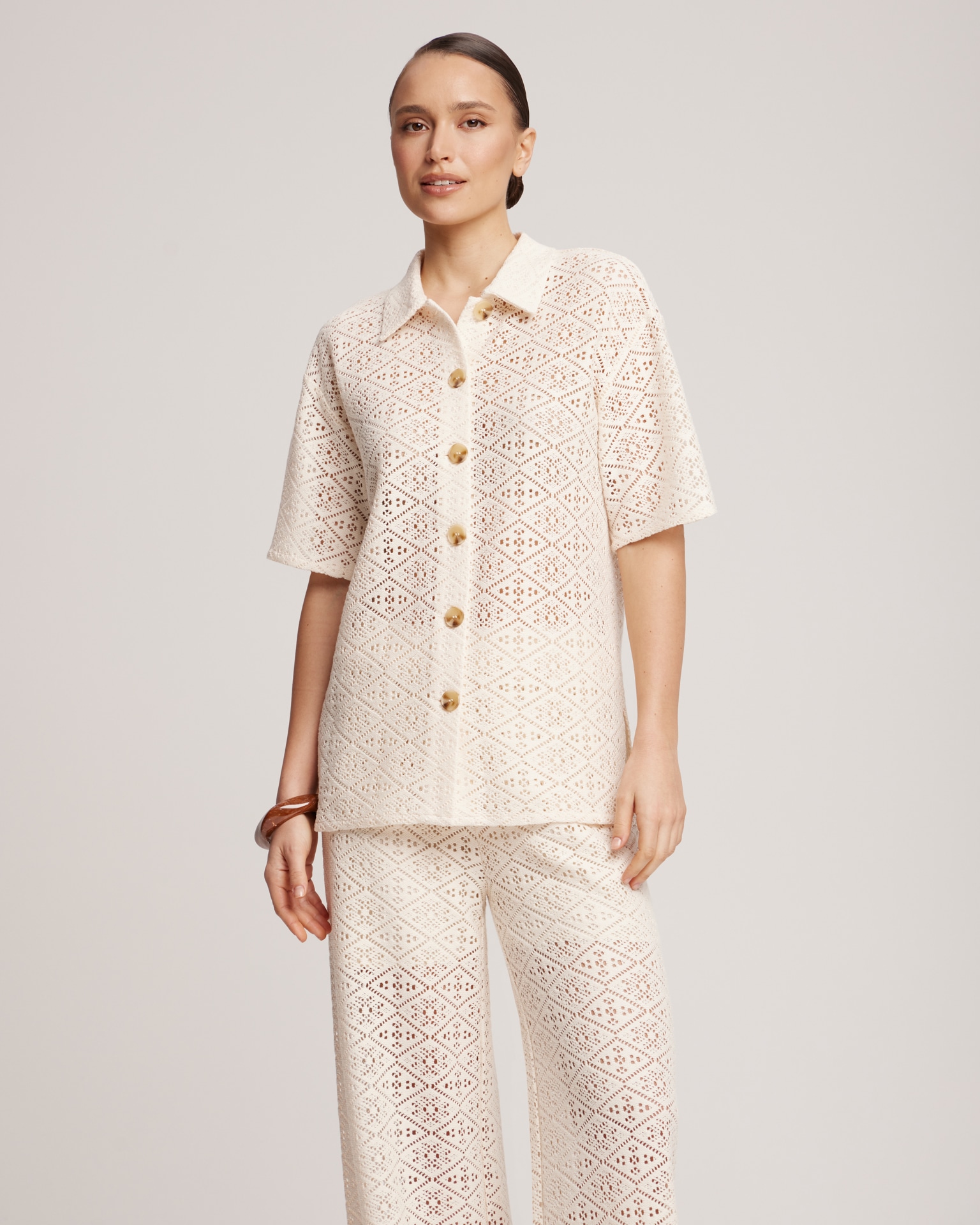 Suit with crochet trousers