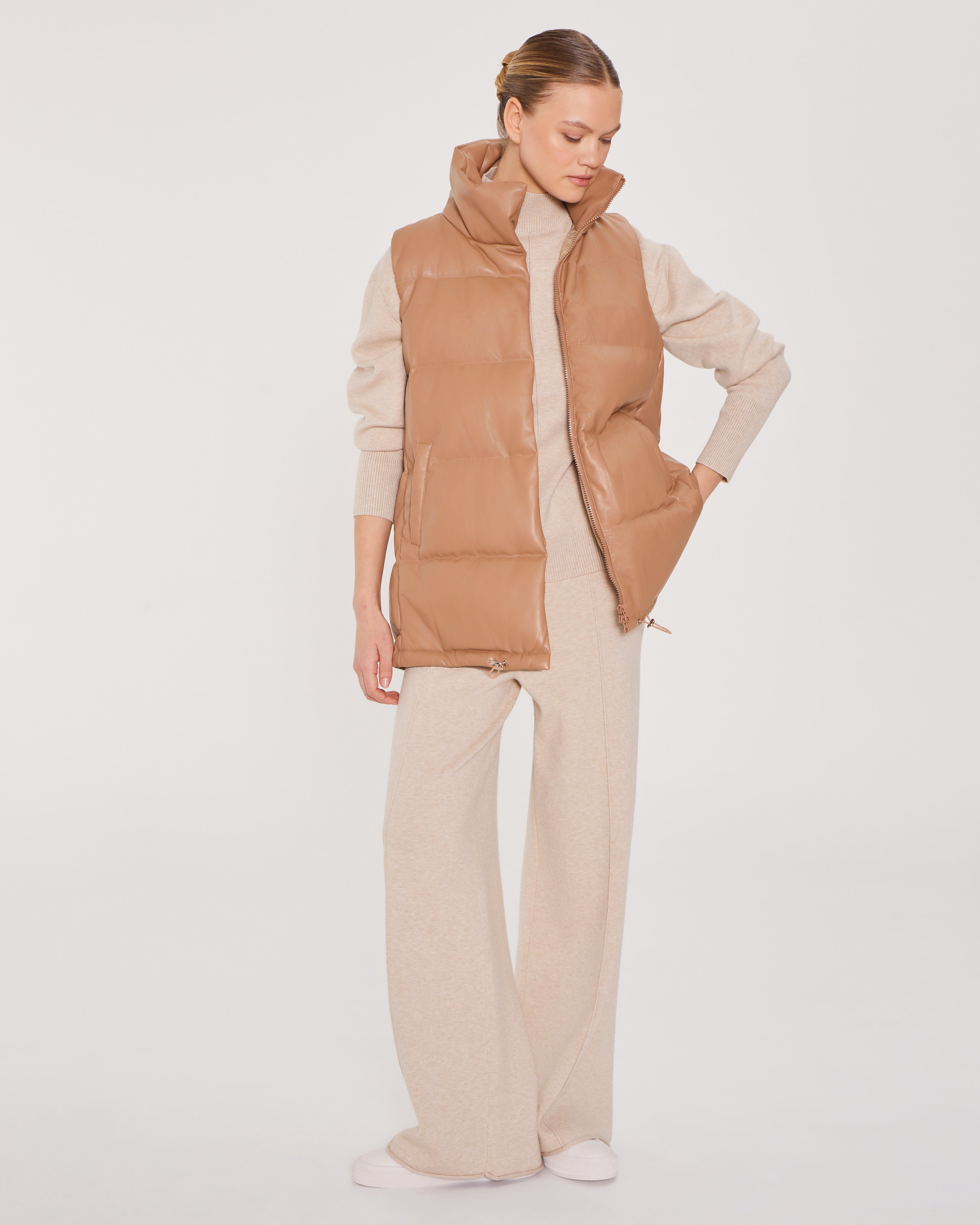 Quilted vest with a stand-up collar in brown