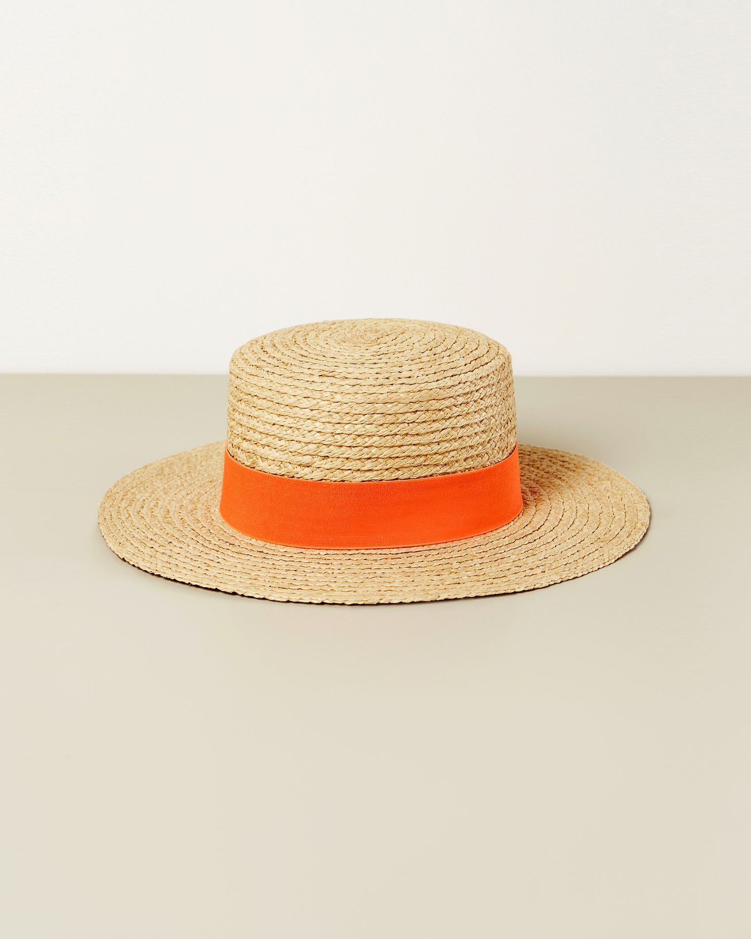 A hat with a contrasting ribbon