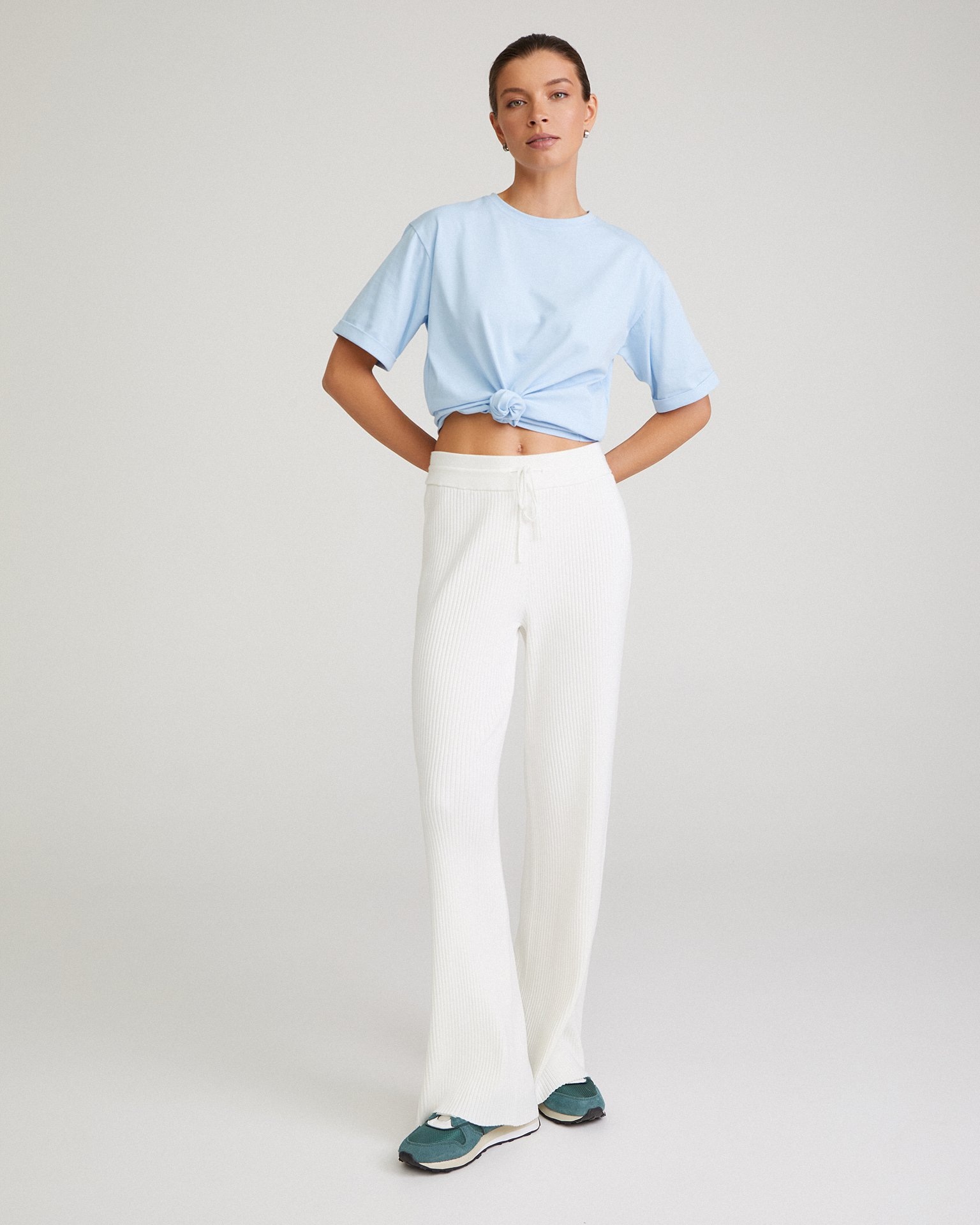 Flared white trousers